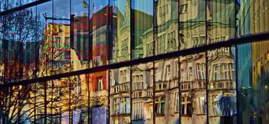 Prague architecture reflection in glass signifying agile business and strategic expansion