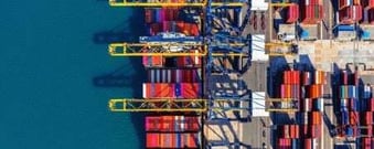Shipping containers at a U.S. port representing trade affected by tariffs