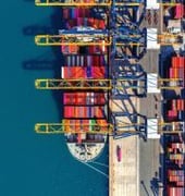 Shipping containers at a U.S. port representing trade affected by tariffs